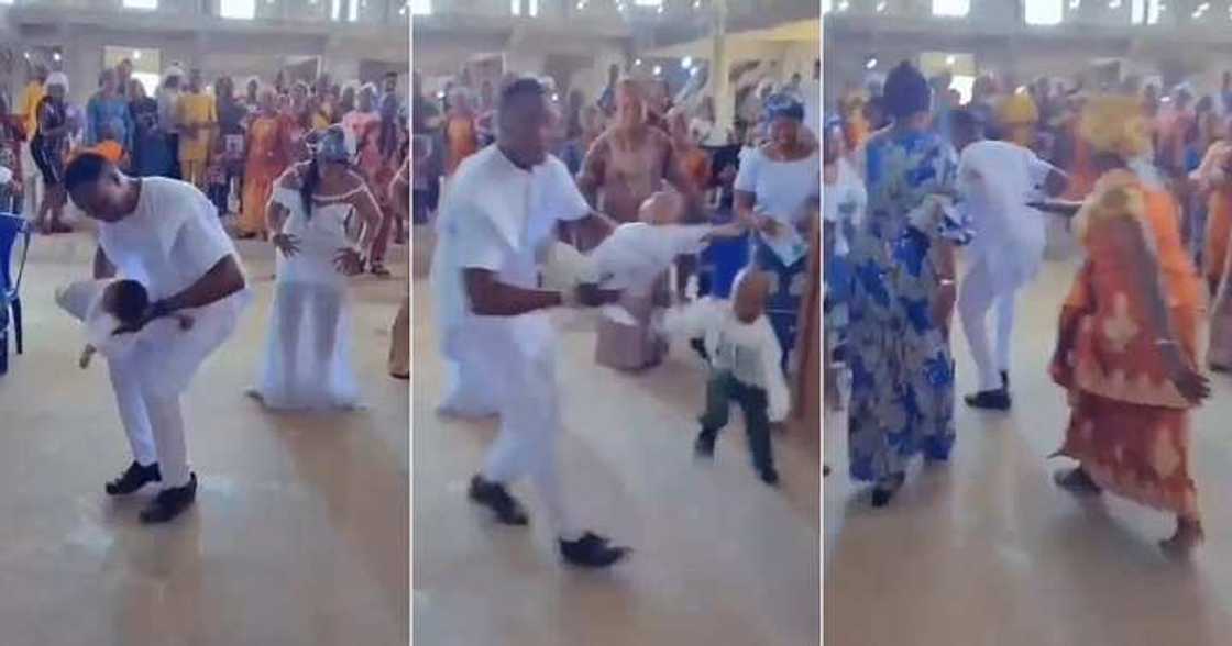 Dad dances with baby in church