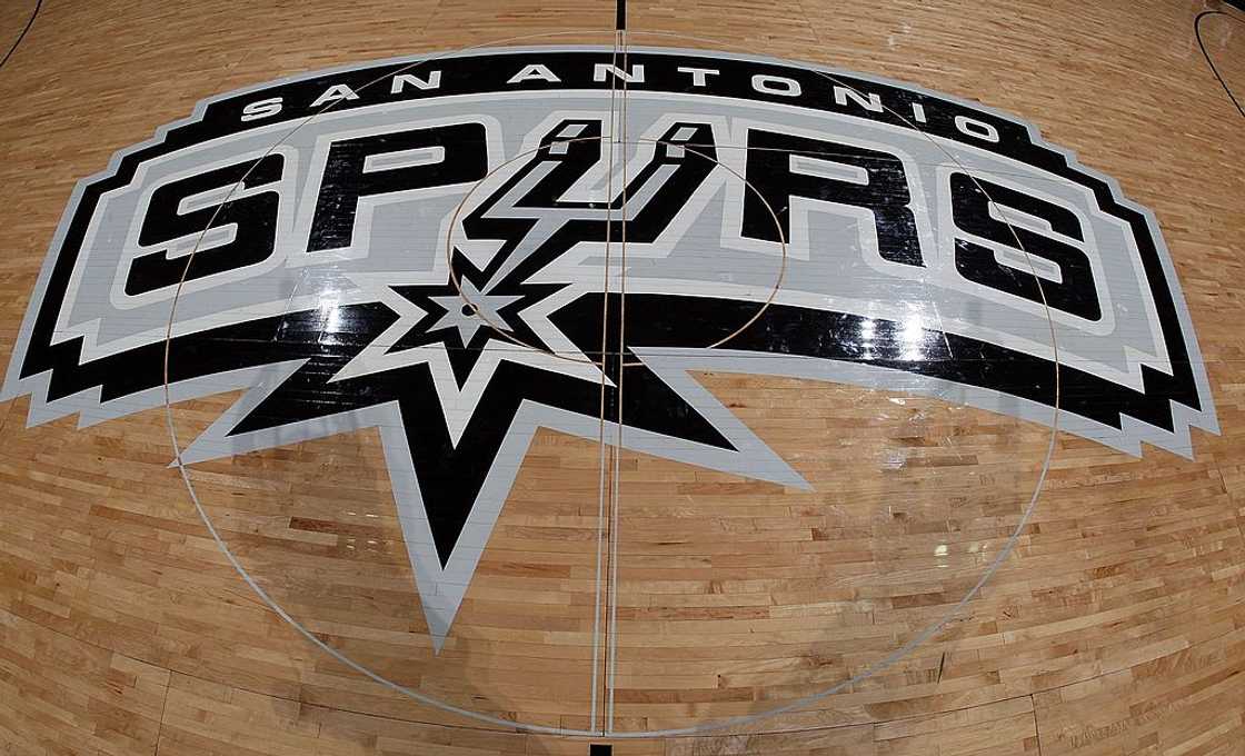 San Antonio Spurs logo on a basketball court