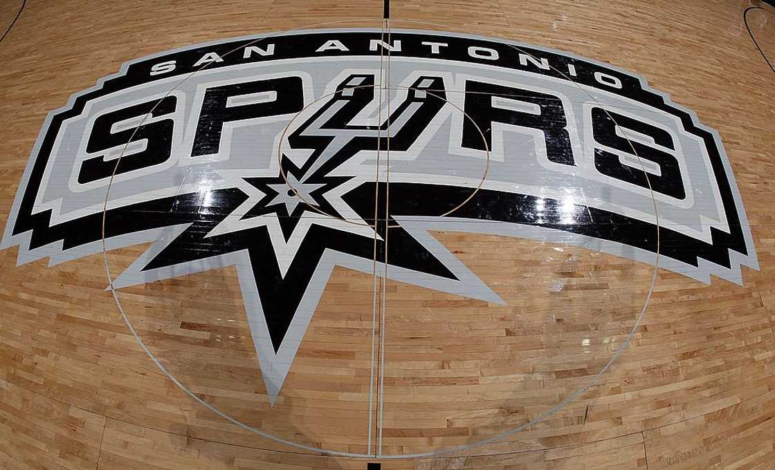 San Antonio Spurs logo on a basketball court San Antonio Spurs logo on a basketball court