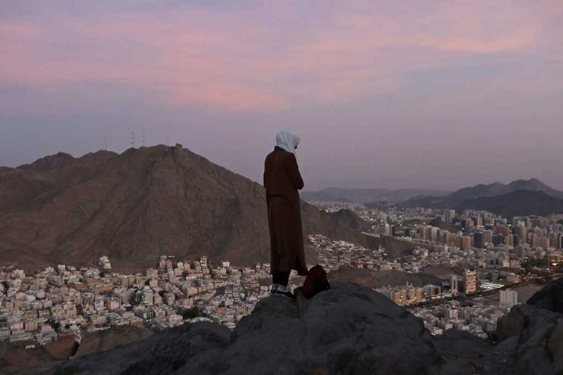 A Muslim pilgrim looks over the holy city of Mecca from atop the Jabal al-Noor or 'Mountain of Light' A Muslim pilgrim looks over the holy city of Mecca from atop the Jabal al-Noor or 'Mountain of Light'