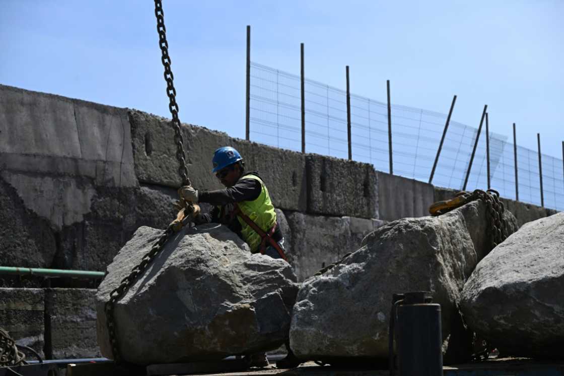 The breakwater at San Antonio is expanded as part of a multi-million-dollar project to boost the port's storm defences The breakwater at San Antonio is expanded as part of a multi-million-dollar project to boost the port's storm defences