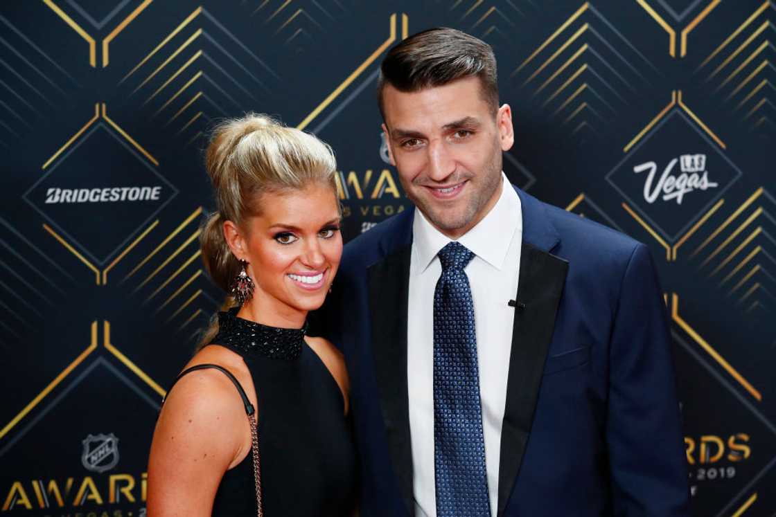 Patrice Bergeron of the Boston Bruins poses for photos on the red carpet with his wife, Stephanie Bertrand Patrice Bergeron of the Boston Bruins poses for photos on the red carpet with his wife, Stephanie Bertrand