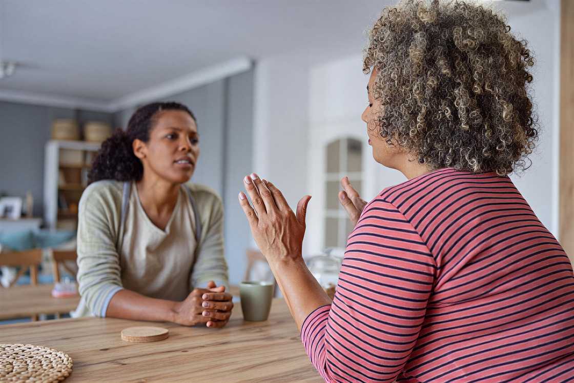A sad woman refuses her friend's help A sad woman refuses her friend's help
