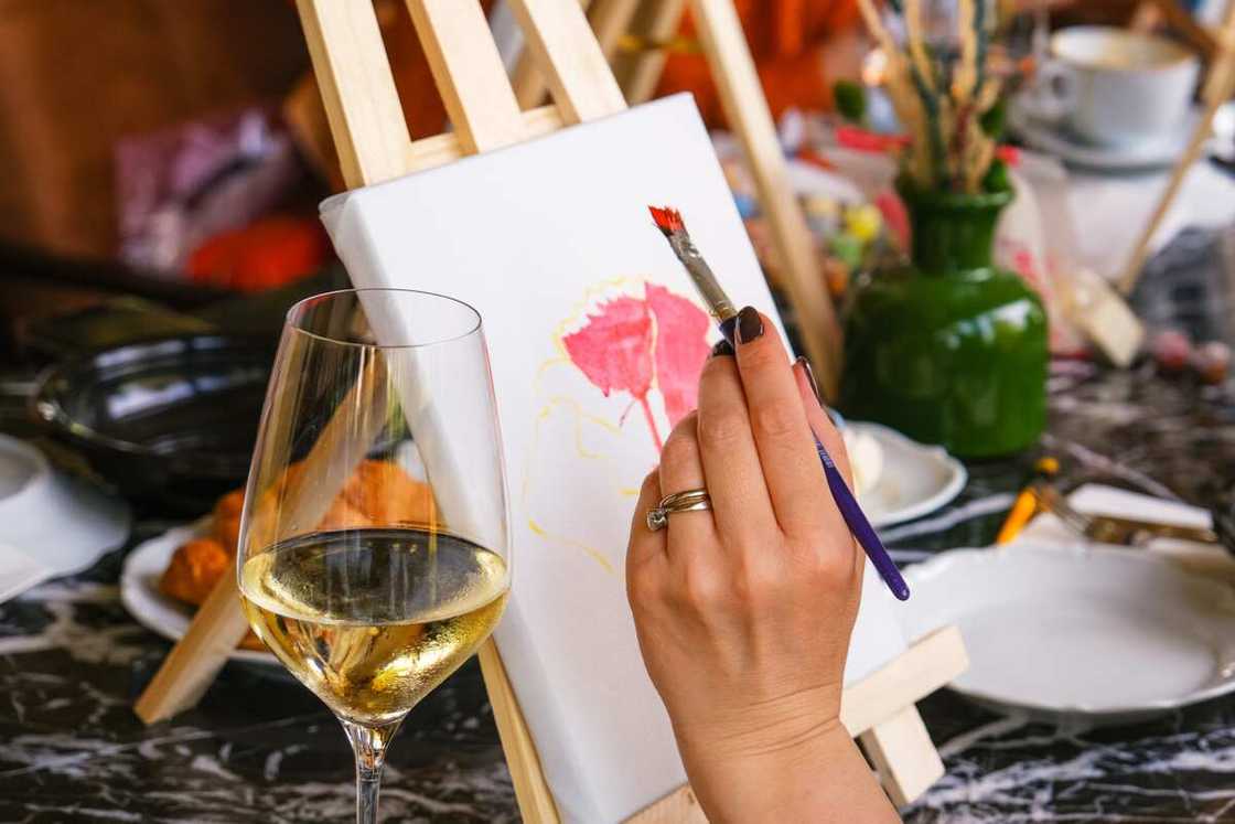 Women drawing picture in art club cafe Women drawing picture in art club cafe