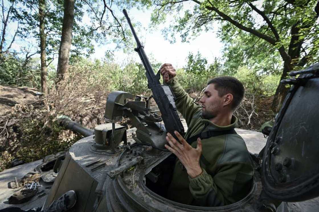 A Ukrainian artilleryman handles a machine gun near the southern frontline in the Mykolaiv region A Ukrainian artilleryman handles a machine gun near the southern frontline in the Mykolaiv region