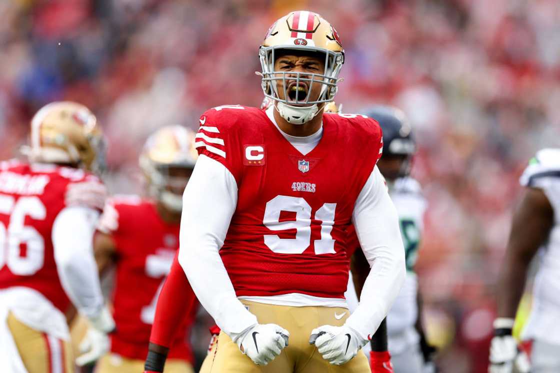 Arik Armstead celebrates after sacking Geno Smith #7 of the Seattle Seahawks during the first quarter in the NFC Wild Card playoff game