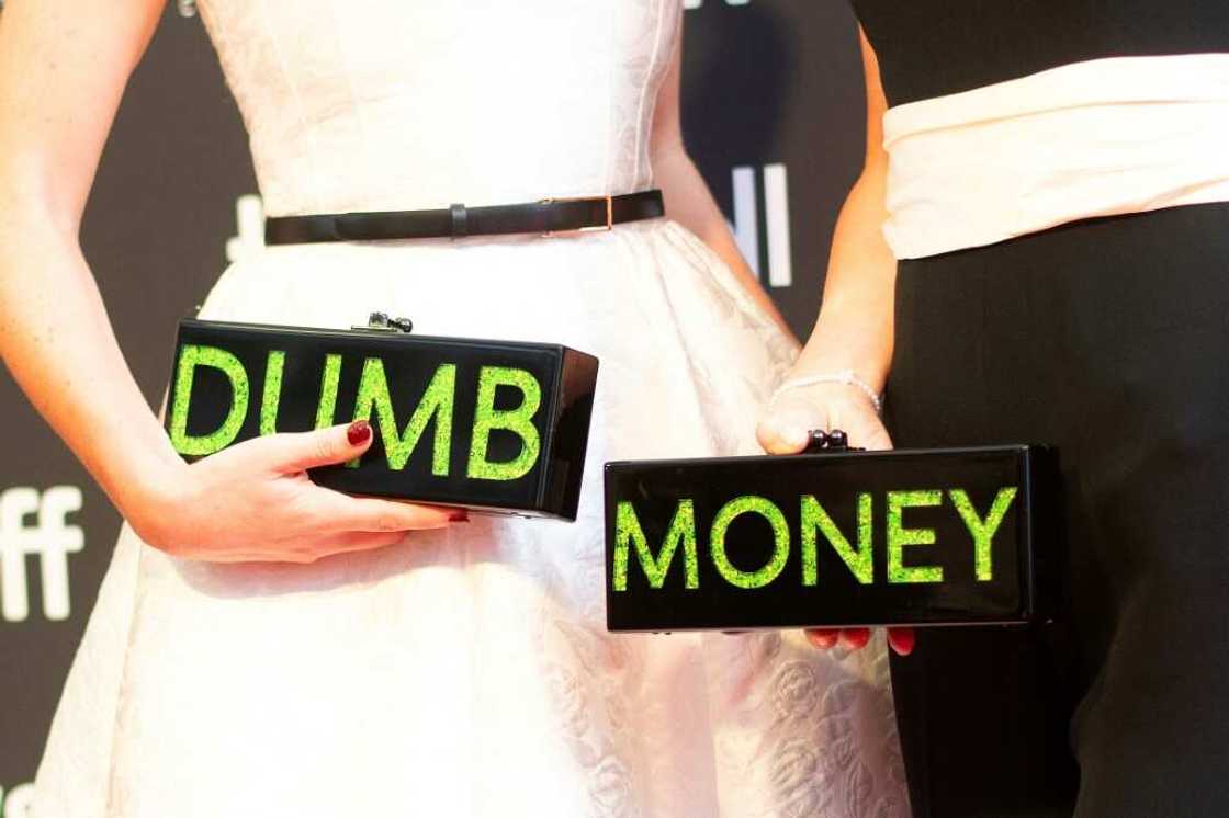 Executive producers and writers Rebecca Angelo (L) and Lauren Schuker Blum (R) repped their film 'Dumb Money' with their handbags at the Toronto premiere Executive producers and writers Rebecca Angelo (L) and Lauren Schuker Blum (R) repped their film 'Dumb Money' with their handbags at the Toronto premiere