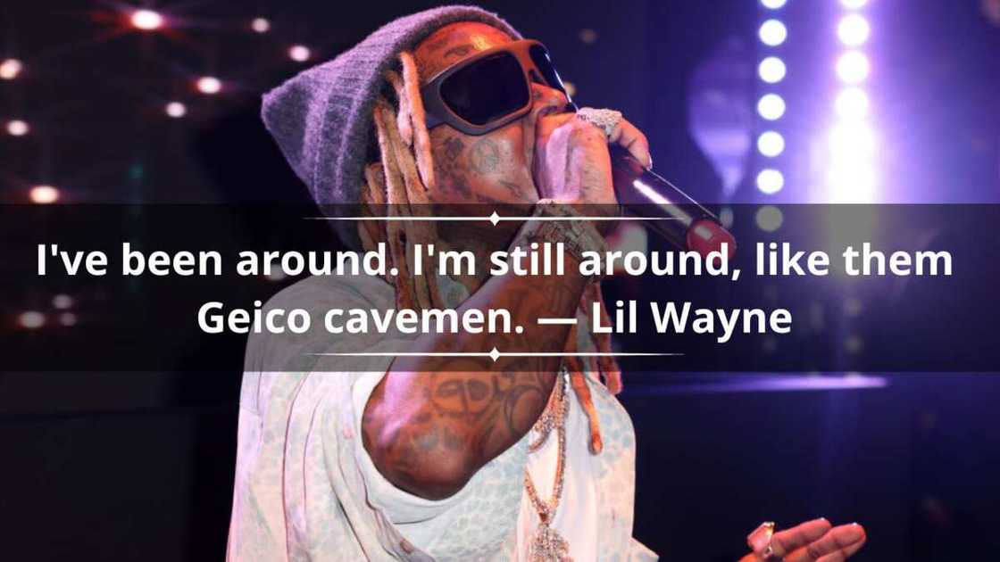 Lil Wayne performing on stage at night. Lil Wayne performing on stage at night.