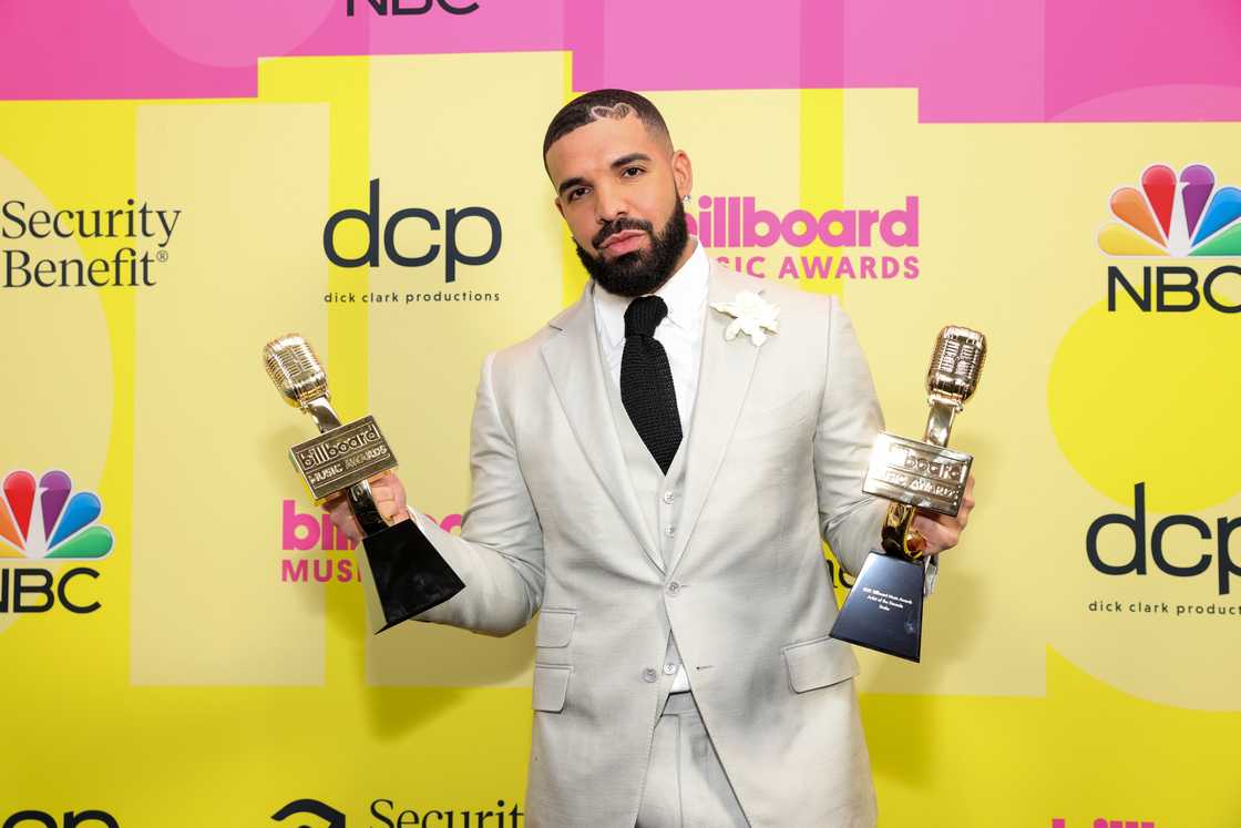 Drake poses backstage for the Billboard Music Awards with his Decade Award at Microsoft Theater in Los Angeles