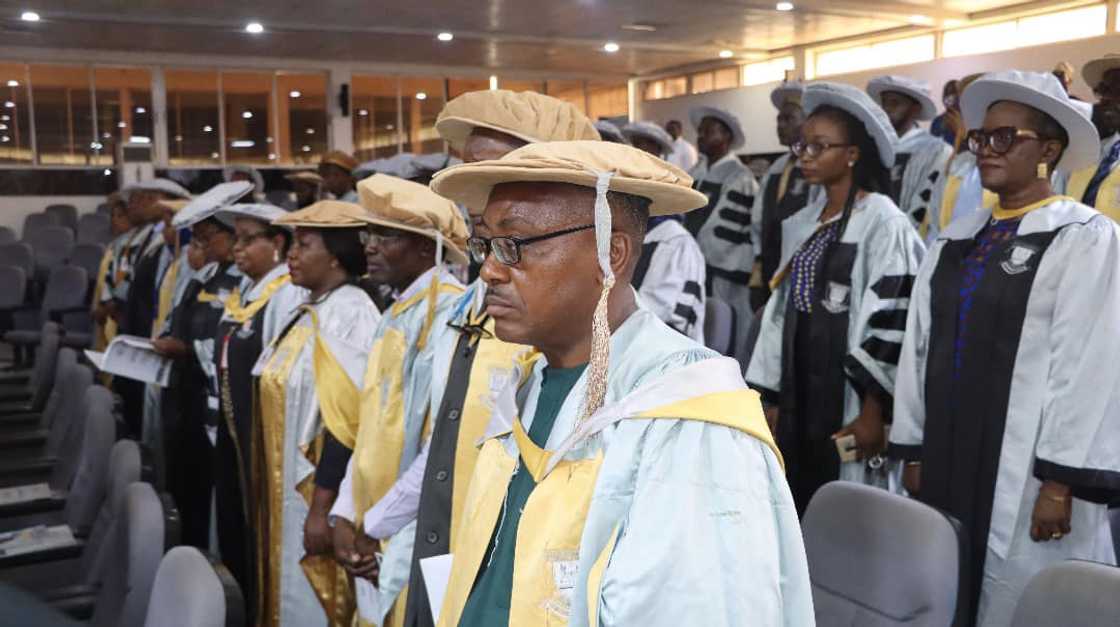 Faculty members stand during a lecture by the Faculty of Computing and Applied Sciences dean, Professor Peter Ogedebe Software Development Faculty members stand during a lecture by the Faculty of Computing and Applied Sciences dean, Professor Peter Ogedebe Software Development