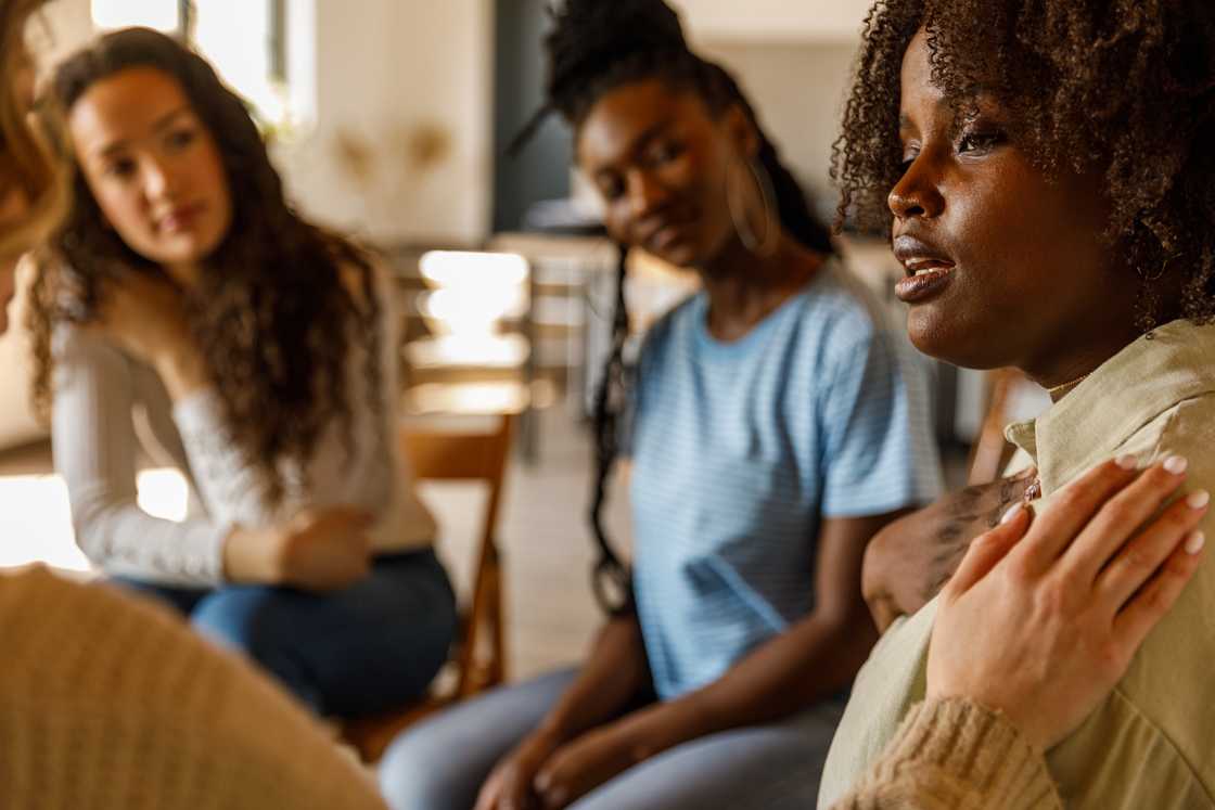 A lady talks to a group of women