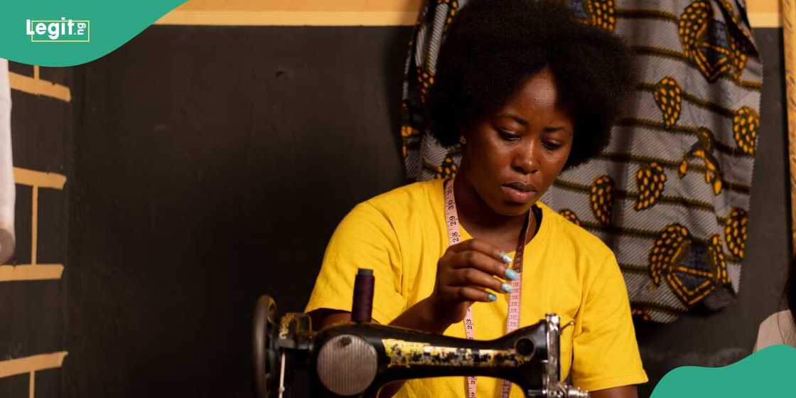 A lady on a sewing machine