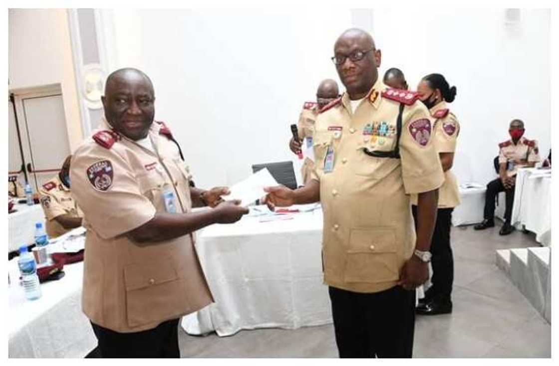 FRSC's boss takes a photo with top official