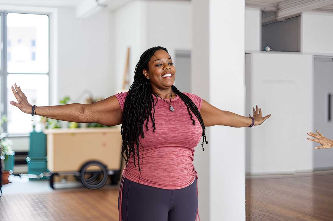 An African woman is stretching An African woman is stretching