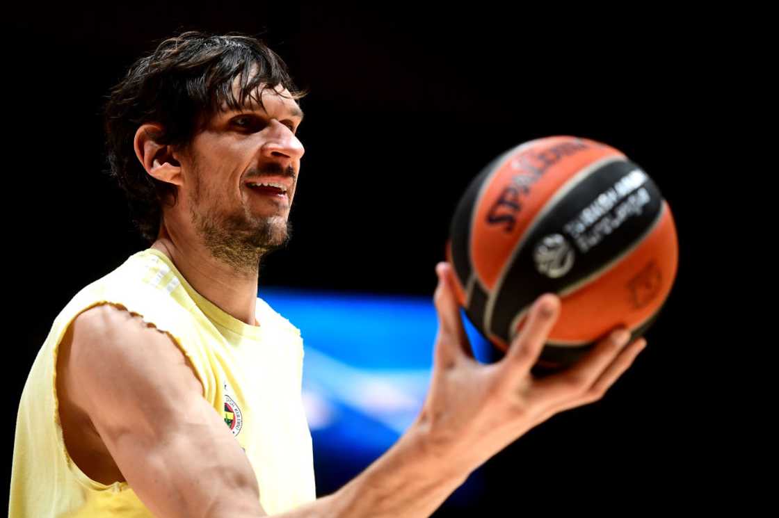 Boban Marjanovic, holding a basketball Boban Marjanovic, holding a basketball