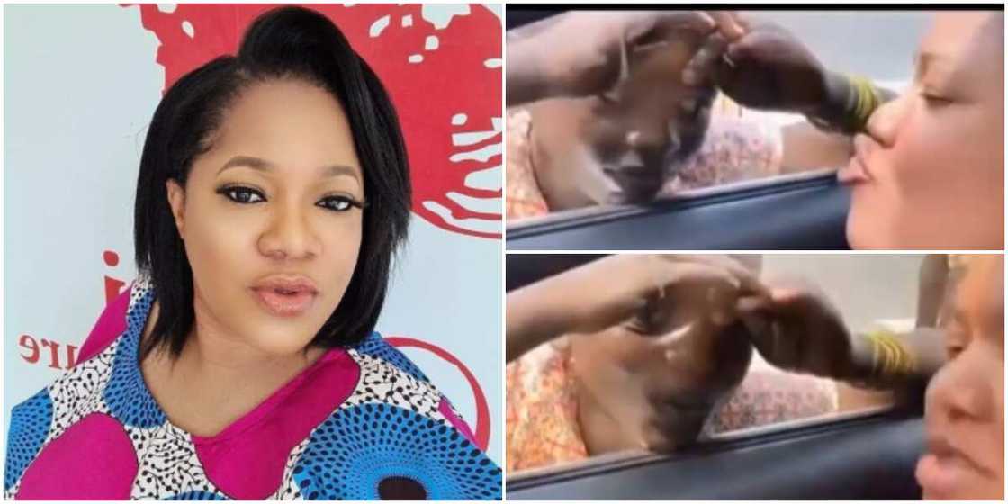 Adorable video captures Toyin Abraham kissing a child beggar through her car window