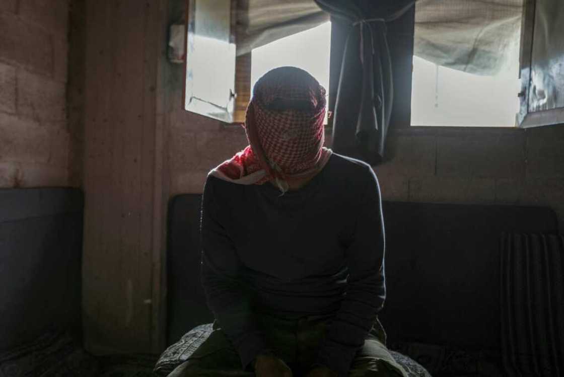 A masked captagon dealer in the Syrian city of Aleppo talks to AFP A masked captagon dealer in the Syrian city of Aleppo talks to AFP