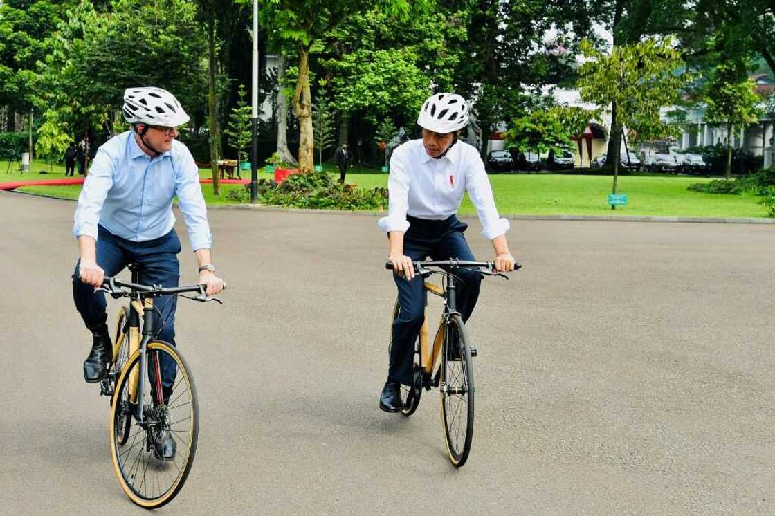 Indonesian President Joko Widodo (R) presented new  Australian Prime Minister Anthony Albanese with a bamboo bike Indonesian President Joko Widodo (R) presented new  Australian Prime Minister Anthony Albanese with a bamboo bike