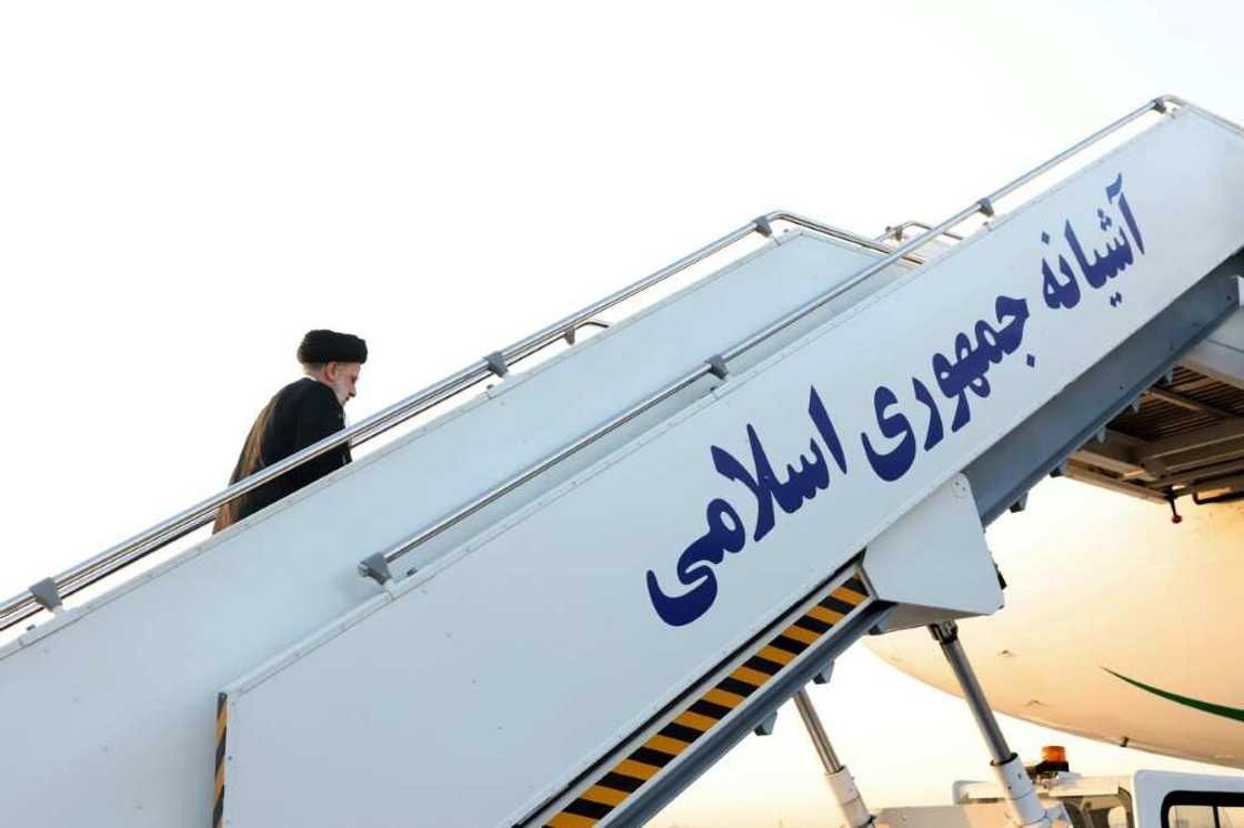 Iran's President Ebrahim Raisi climbs the stairs to his aircraft before departure from the capital Tehran's Mehrabad International Airport en route to the United Nations General Assembly Iran's President Ebrahim Raisi climbs the stairs to his aircraft before departure from the capital Tehran's Mehrabad International Airport en route to the United Nations General Assembly