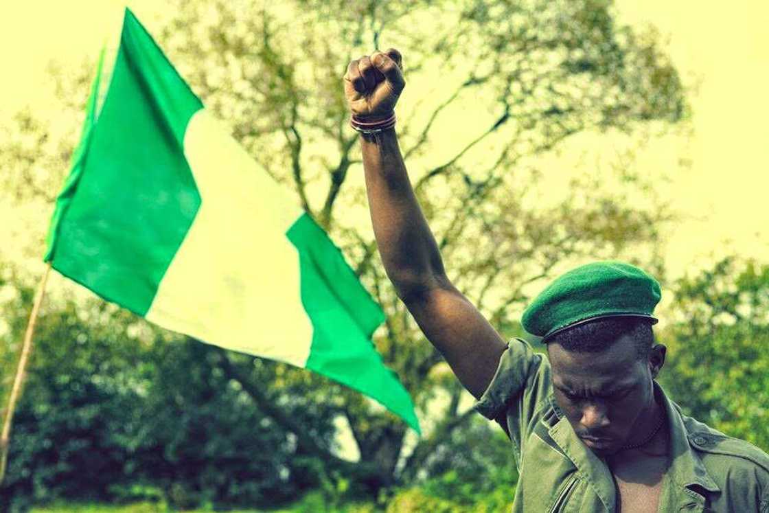 A Nigerian with a flag A Nigerian with a flag
