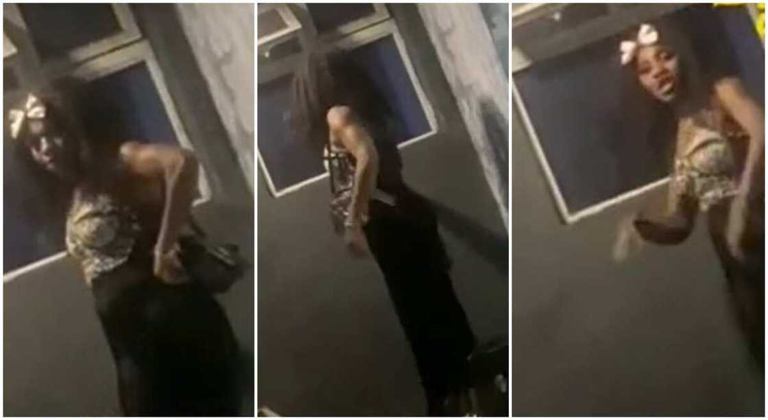 Photos of a Nigerian woman standing at the window of a Lagos hotel where her boyfriend is lodging with another woman. Photos of a Nigerian woman standing at the window of a Lagos hotel where her boyfriend is lodging with another woman.