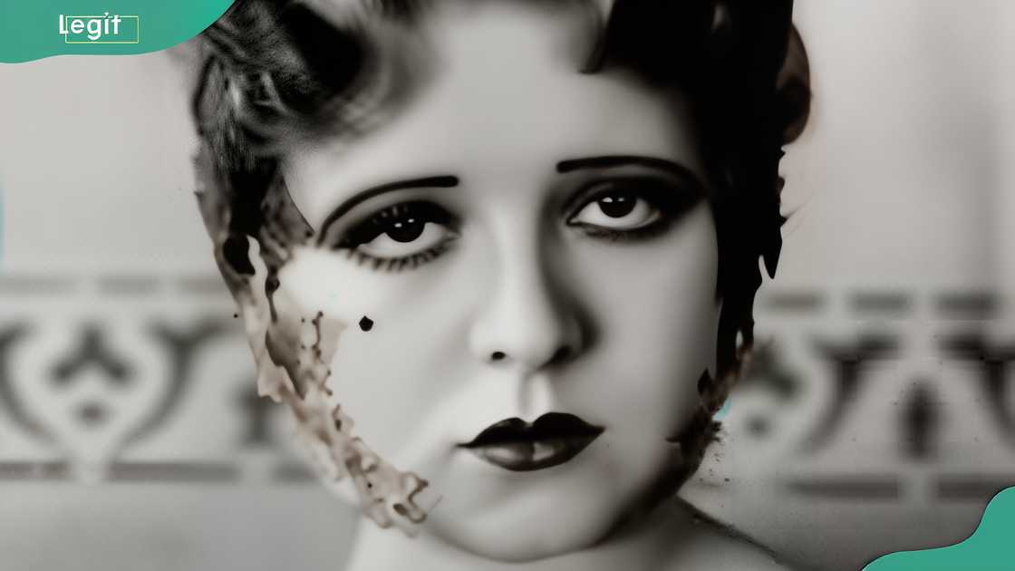 Elegant woman in sleeveless gown posing in studio Elegant woman in sleeveless gown posing in studio