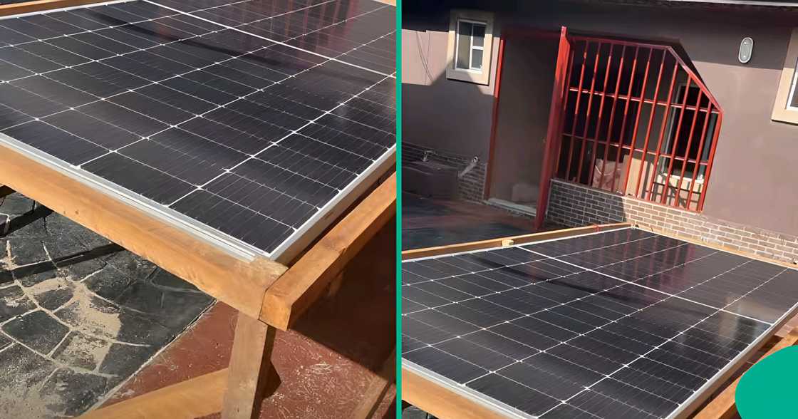 Nigerian tenant places solar panels on wooden ground frame after landlord prohibited roof installation completely.
