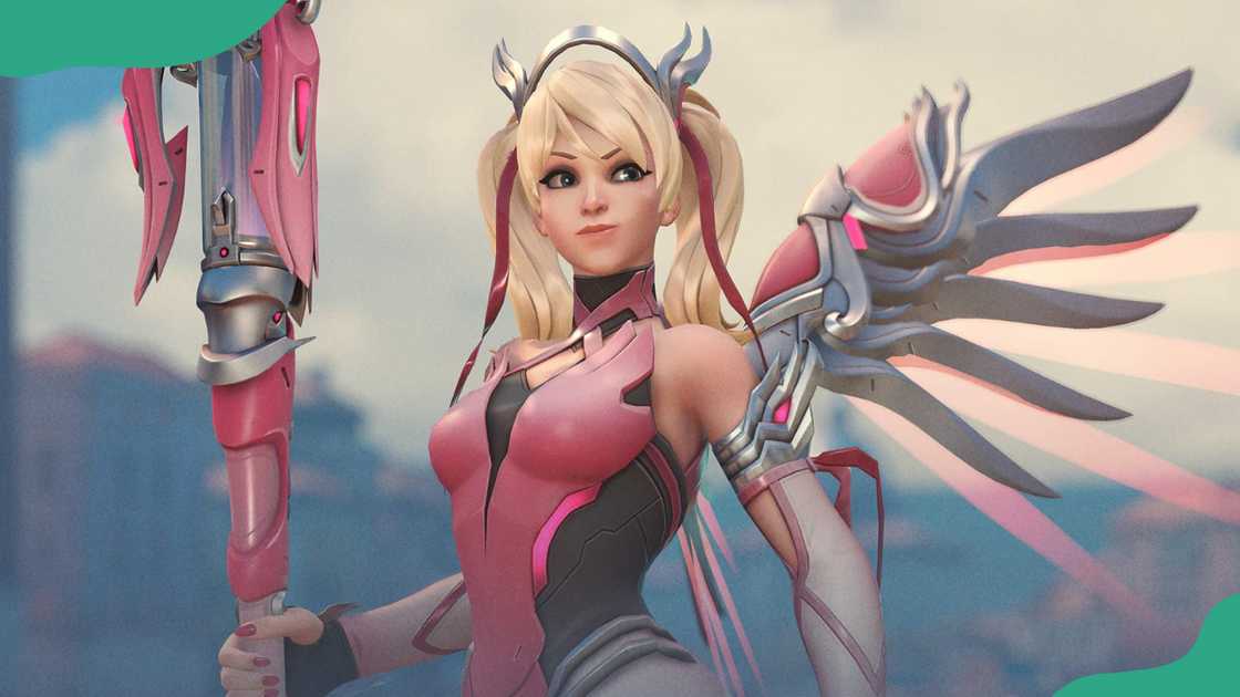 Mercy soars with her healing staff.