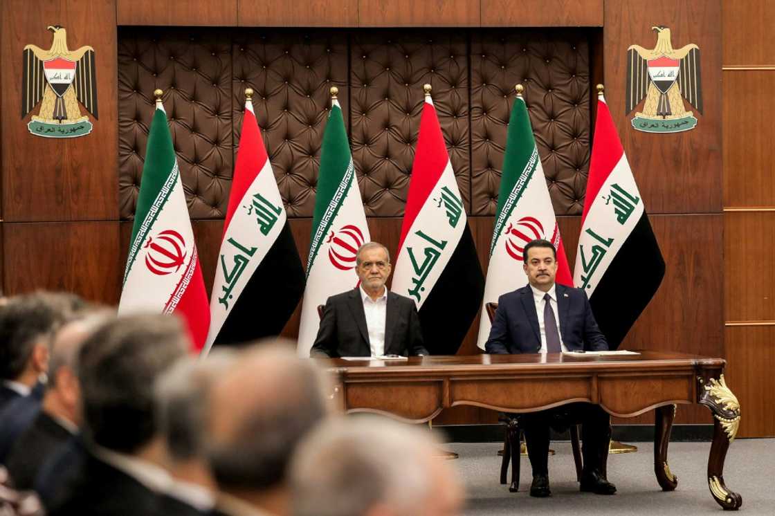 Iraqi Prime Minister Mohammed Shia al-Sudani (R) and Iranian President Masoud Pezeshkian attend a ceremony for the signing of memoranda of understanding in Baghdad Iraqi Prime Minister Mohammed Shia al-Sudani (R) and Iranian President Masoud Pezeshkian attend a ceremony for the signing of memoranda of understanding in Baghdad
