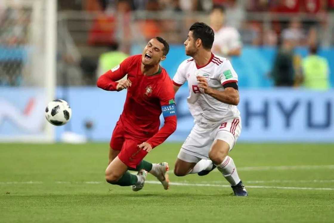 Ronaldo hacked down by an Iranian defender during the contest on Monday night as Portugal settled for a 1-1 draw with the Asians. Photo Credit: Getty Images Ronaldo hacked down by an Iranian defender during the contest on Monday night as Portugal settled for a 1-1 draw with the Asians. Photo Credit: Getty Images