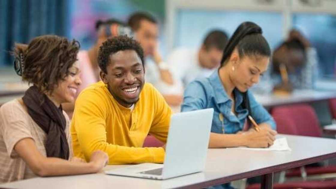 students with laptop