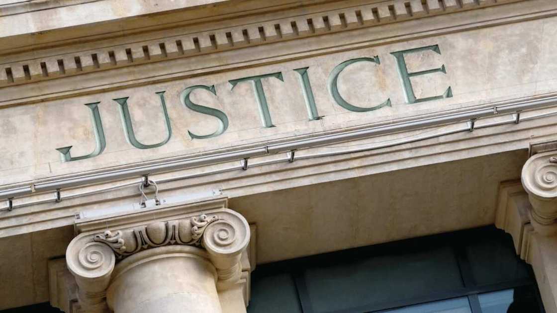 Justice sign on court building Justice sign on court building