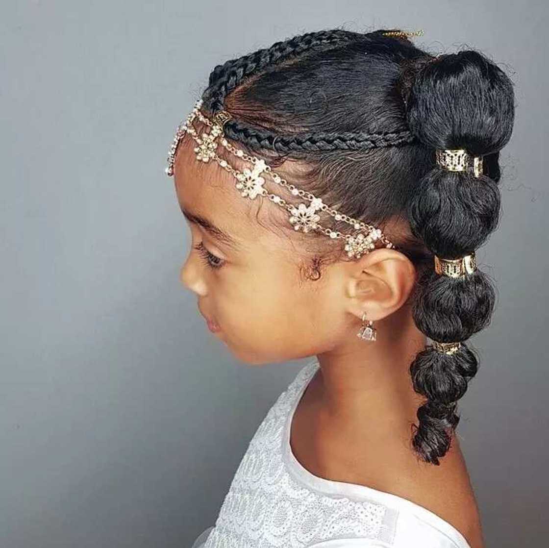 Little bride hairstyle with braids and ponytail