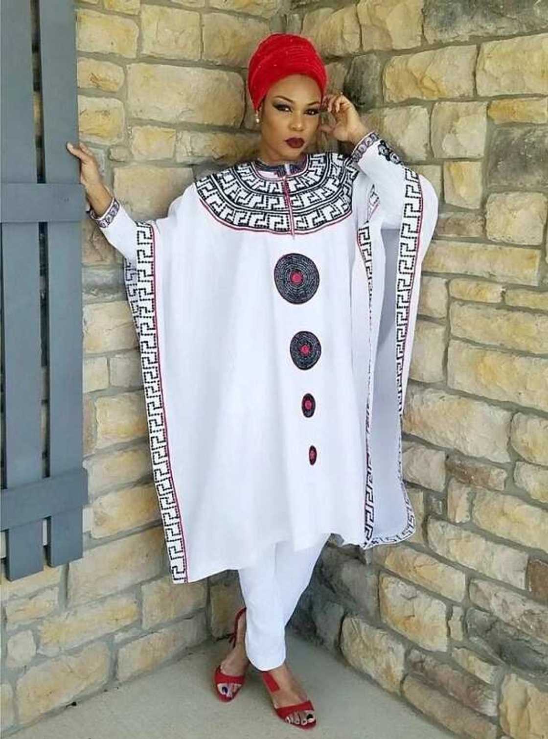 White Agbada style with bright ornament White Agbada style with bright ornament