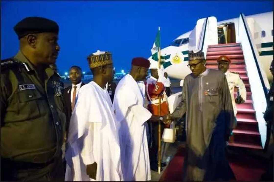 Buhari returning from a previous trip / File Photo Buhari returning from a previous trip / File Photo