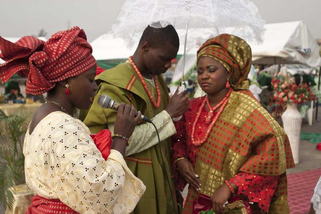 Praying for the couple at Yoruba engagement ceremony Praying for the couple at Yoruba engagement ceremony