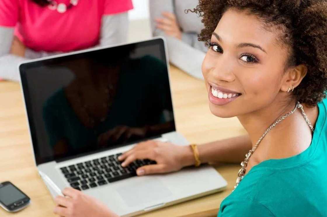 Smiling woman and laptop Smiling woman and laptop