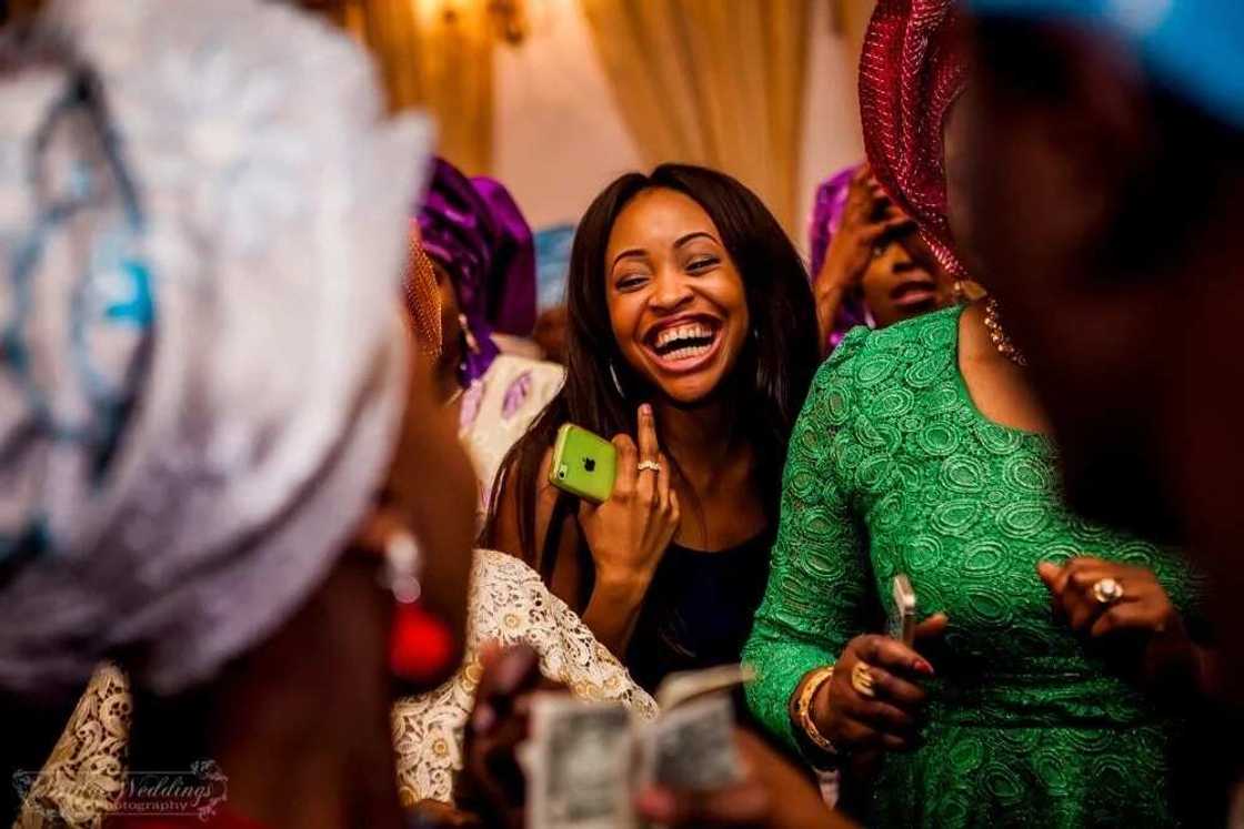 Nigerian wedding - guests laugh