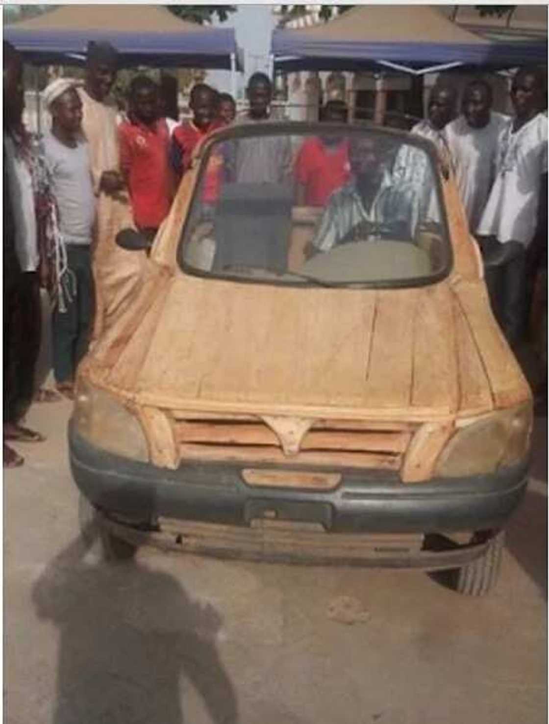 Nigerian constructs a car with wood and motorcycle engine Nigerian constructs a car with wood and motorcycle engine