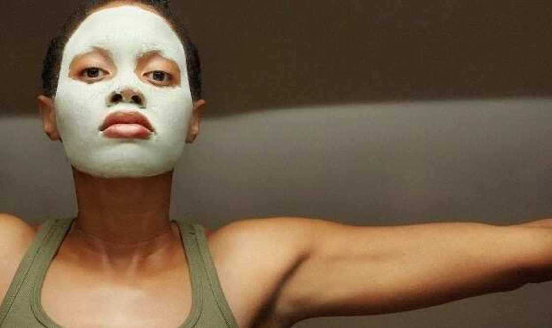 woman with clay mask woman with clay mask