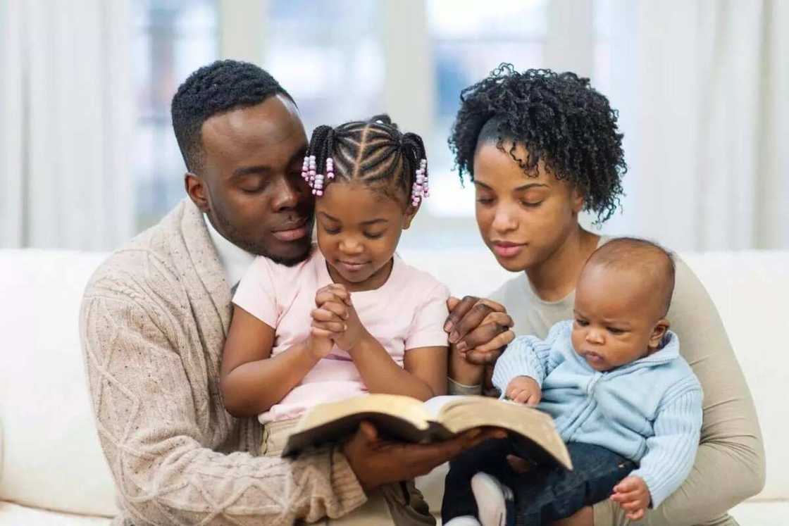 The family with the Bible The family with the Bible