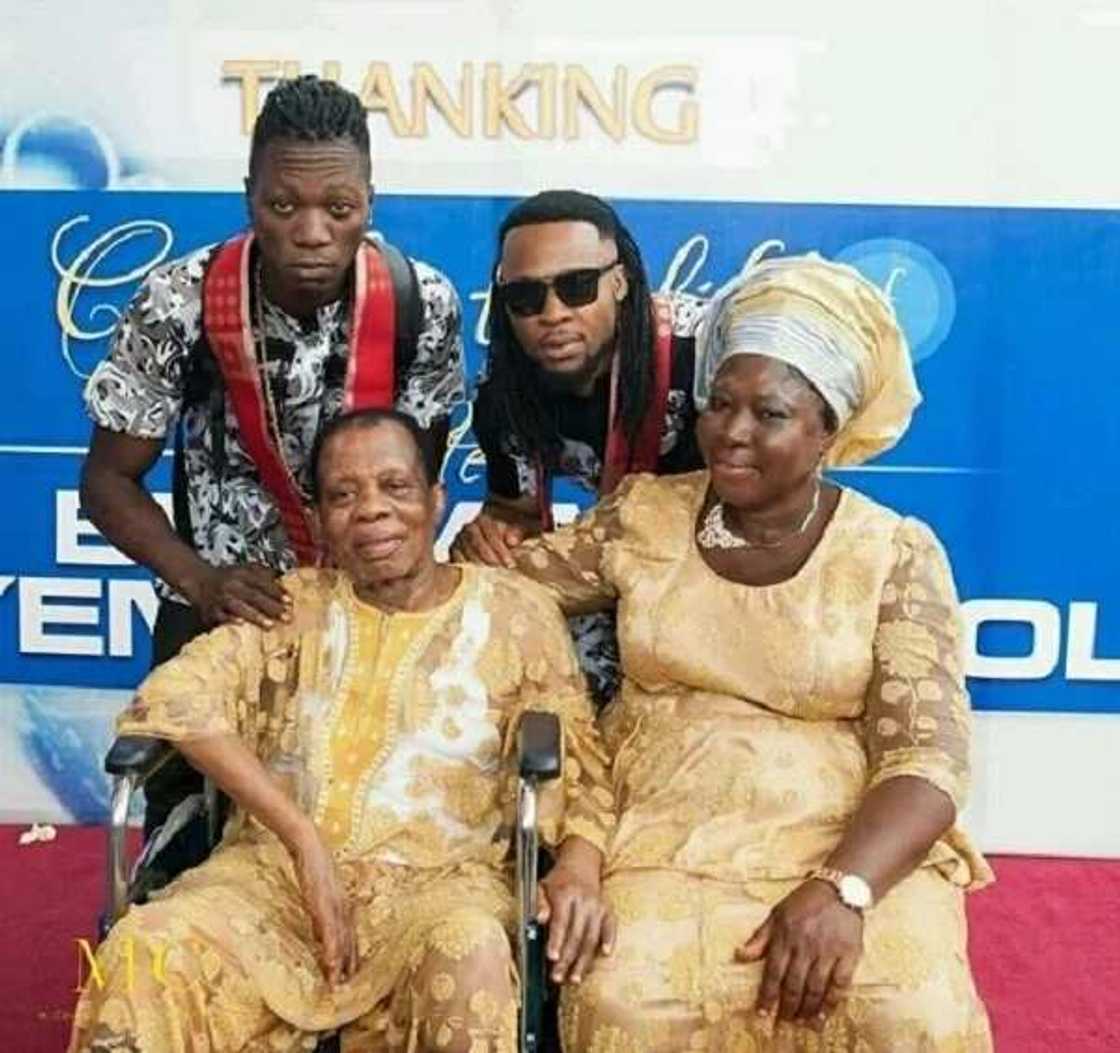 Flavour, his mother and brother DJ Derekz at the birthday celebration of Elder Benjamin Okoli in 2016. Photo: 2niteflavour on Instagram Flavour, his mother and brother DJ Derekz at the birthday celebration of Elder Benjamin Okoli in 2016. Photo: 2niteflavour on Instagram