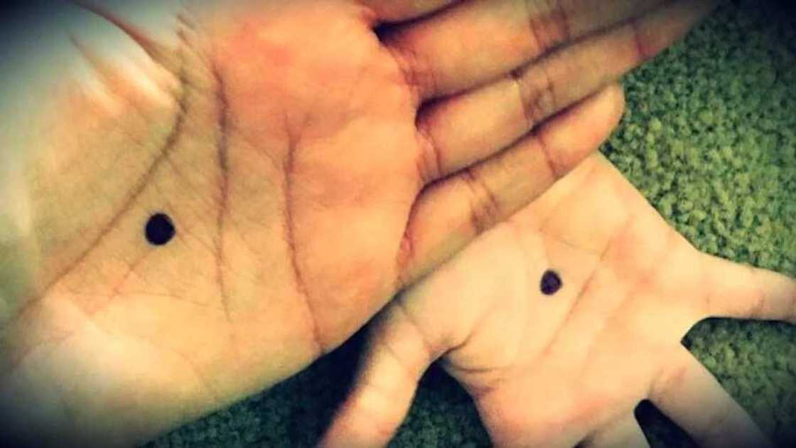 If you notice someone with a black dot on the palm, call the police immediately! If you notice someone with a black dot on the palm, call the police immediately!