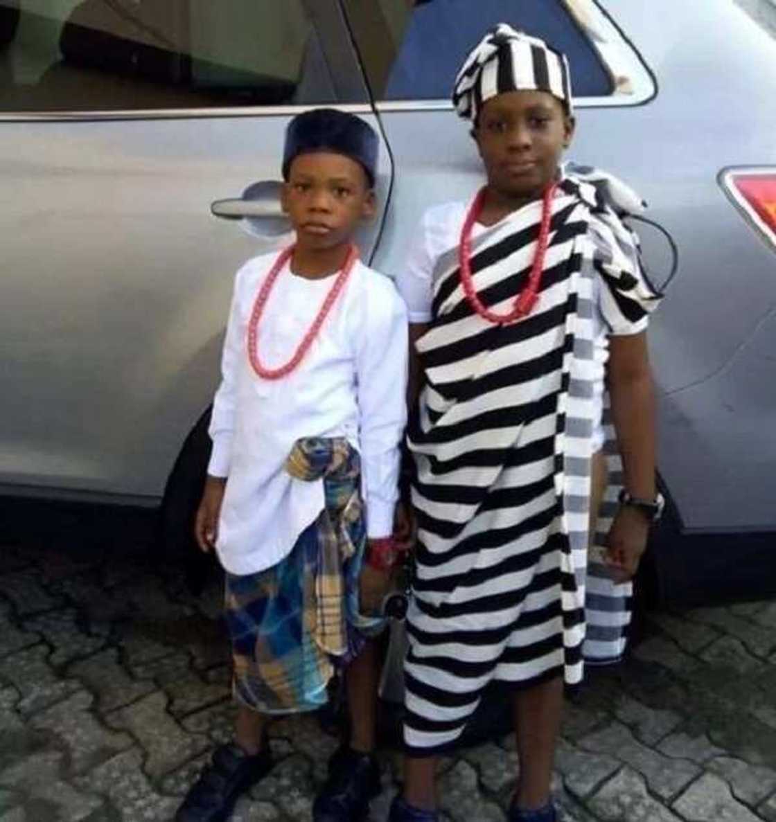 Igbo traditional attire with a wrapper in a cage or strip. Igbo traditional attire with a wrapper in a cage or strip.
