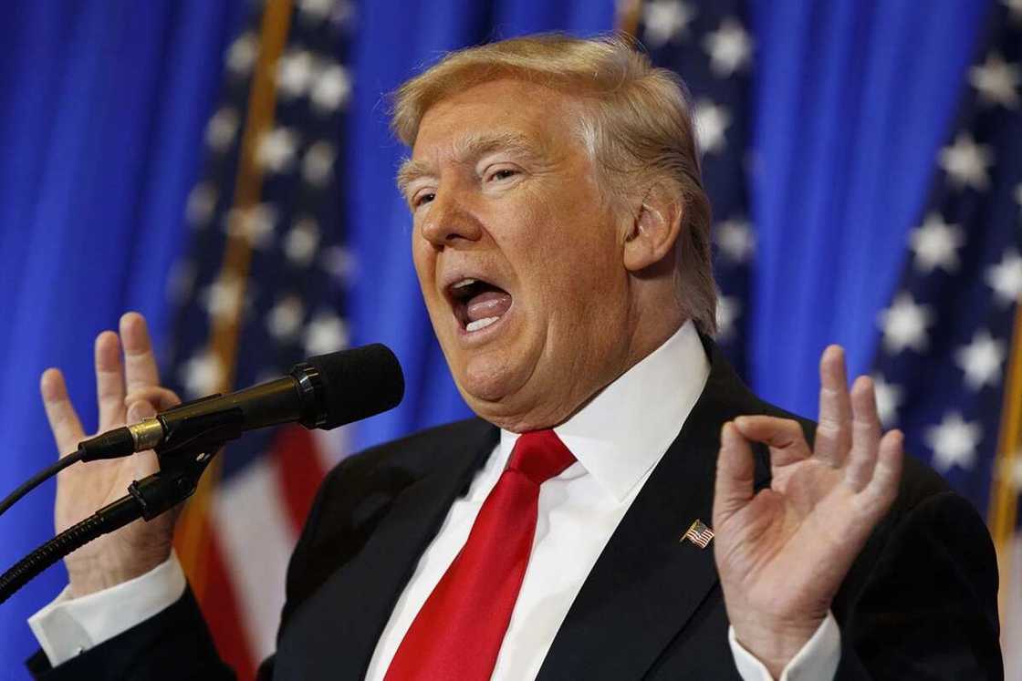 Trump speaking and gesticulating while on a suit Trump speaking and gesticulating while on a suit