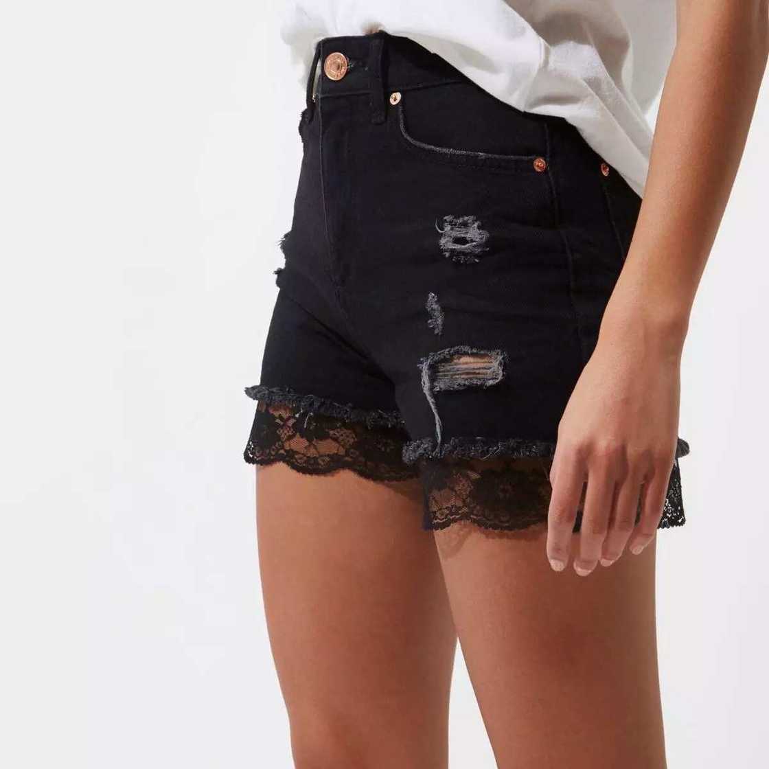 Jeans shorts with French lace trim Jeans shorts with French lace trim