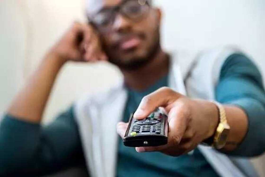 A man watching TV