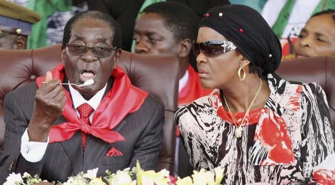 Robert Mugabe with his wife, Grace Mugabe Robert Mugabe with his wife, Grace Mugabe