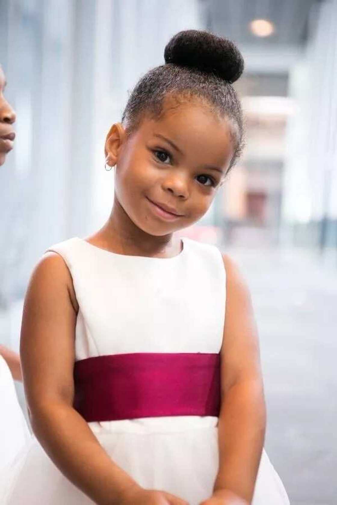 Little bride hairstyle with bun Little bride hairstyle with bun