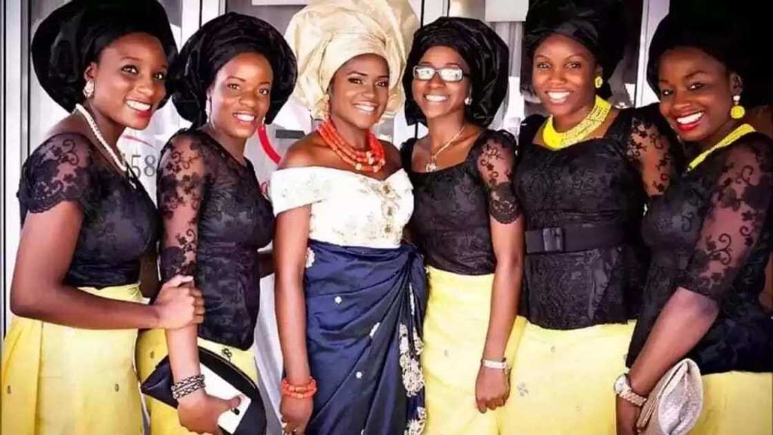 Nigerian black lace blouse styles with various necklines Nigerian black lace blouse styles with various necklines